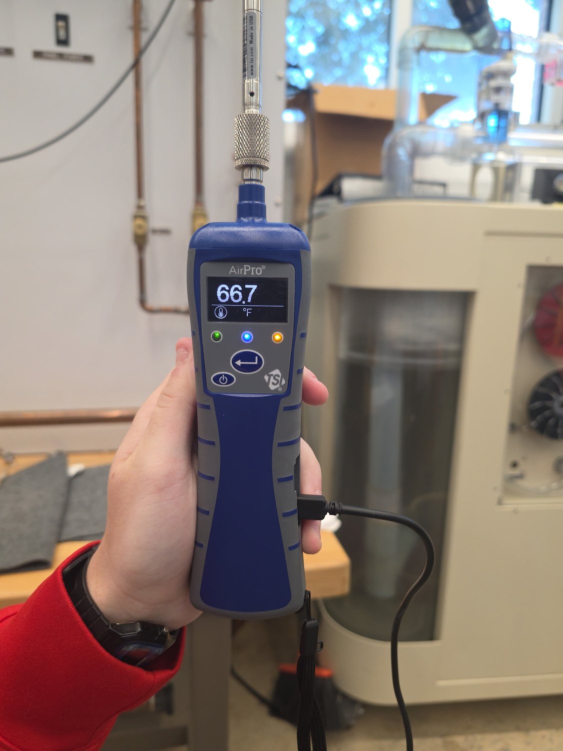 A TSI AirPro anemometer reading the tunnel conditions.