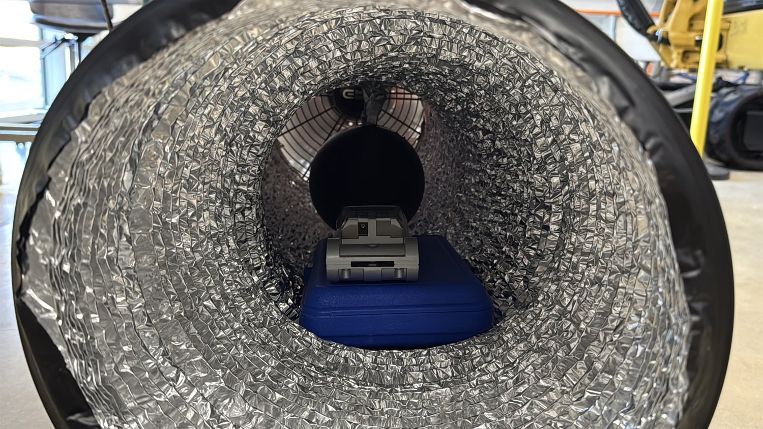 A test model mounted on the sting inside the tunnel.
